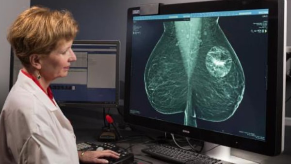 Doctor looking at breast imaging screen